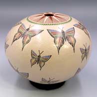Polychrome seed pot with a sgraffito and painted butterfly and geometric design
 by Oscar Ramirez of Mata Ortiz and Casas Grandes