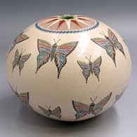 Polychrome seed pot with a sgraffito and painted butterfly, mesh and geometric design
 by Oscar Ramirez of Mata Ortiz and Casas Grandes