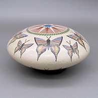 Polychrome seed pot with a sgraffito-and-painted butterfly and geometric design
 by Oscar Ramirez of Mata Ortiz and Casas Grandes