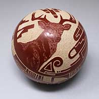A red seed pot with a sgraffito stag, bird element and geometric design
 by Thomas Polacca of Hopi