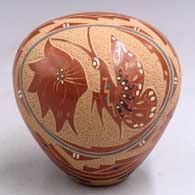 Polychrome seed pot with a sgraffito and painted butterfly, flower and geometric design
 by Helen Tafoya of Jemez