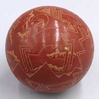 Red seed pot with a sgraffito pronghorn antelope and geometric designJ49
 by Susan Romero of Santa Clara