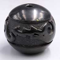 Miniature black seed pot carved with an avanyu design on a micaceous black backgroundG07
 by Linda Tafoya of Santa Clara
