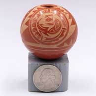 Miniature red seed pot with a 3-medallion and geometric design with a quail, a turtle and a lizardG75
 by Mae Tapia of Santa Clara