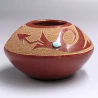 Red seed pot with a sgraffito avanyu design above the shoulder and an inlaid stone
 by Goldenrod of Santa Clara