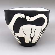 Black-on-white jar with an organic form and a brontosaurus dinosaur design
 by William Pacheco of Santo Domingo