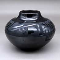 Click for a larger view A black on black jar decorated with a feather and geometric design around and above the shoulder
by Adam and Santana Martinez of San Ildefonso
