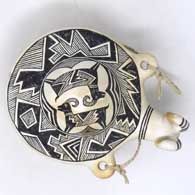 Black and white canteen with a bighorn ram's head spout and Mimbres ram and geometric design