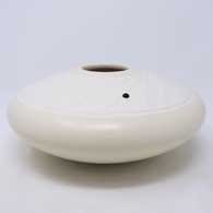 White seed pot with a sculpted Shifting Sands design surface with tiny flecks of mica and an inlaid stone