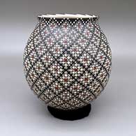 A polychrome jar with a slightly flared opening and a cuadrillos geometric design