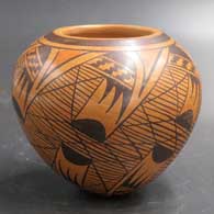 A polychrome seed pot jar decorated with a migration pattern design