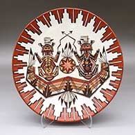 A polychrome shallow bowl decorated with a yeibichai, feather, cloud pattern and geometric design