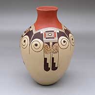 A polychrome jar decorated with a four-panel eagletail and geometric design