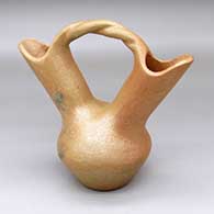 A golden micaceous wedding vase with fire clouds