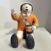 A sitting drummer figure