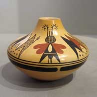 A polychrome jar decorated above the shoulder with a two panel moth and geometric design