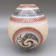 A polychrome jar decorated with a sgraffito and painted lizard, bighorn sheep, and geometric design