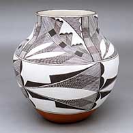 Black-on-white jar decorated with a fine line and geometric design