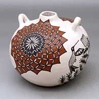 A polychrome round backed canteen decorated with a cactus flower, hummingbird and geometric design