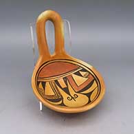 A polychrome ladle decorated with a geometric design and fire clouds