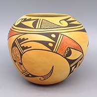 A polychrome jar decorated with fire clouds and a three-panel bird element and geometric design