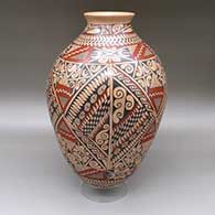 A large polychrome jar with a flared opening and decorated with a cuadrillos, fine line and geometric design