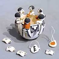 A polychrome story-time bowl with five children, a puppy and several turtles and canteens