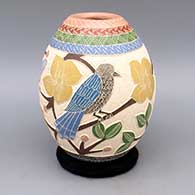 Polychrome jar with sgraffito and painted bird, butterfly, branch, flower, berry, and geometric design