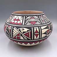 A polychrome jar with bands of geometric design around the body