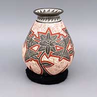 A polychrome jar with flared lip and sgraffito and painted hummingbird, flower, leaf, and geometric design