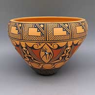 A polychrome bowl decorated with a deer-with-heart-line, snake, kiva step, and geometric design