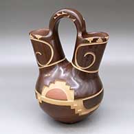 A polychrome wedding vase decorated with a carved and sgraffito kiva step and geometric design