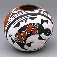 A polychrome seed pot decorated with a lizard and geometric design