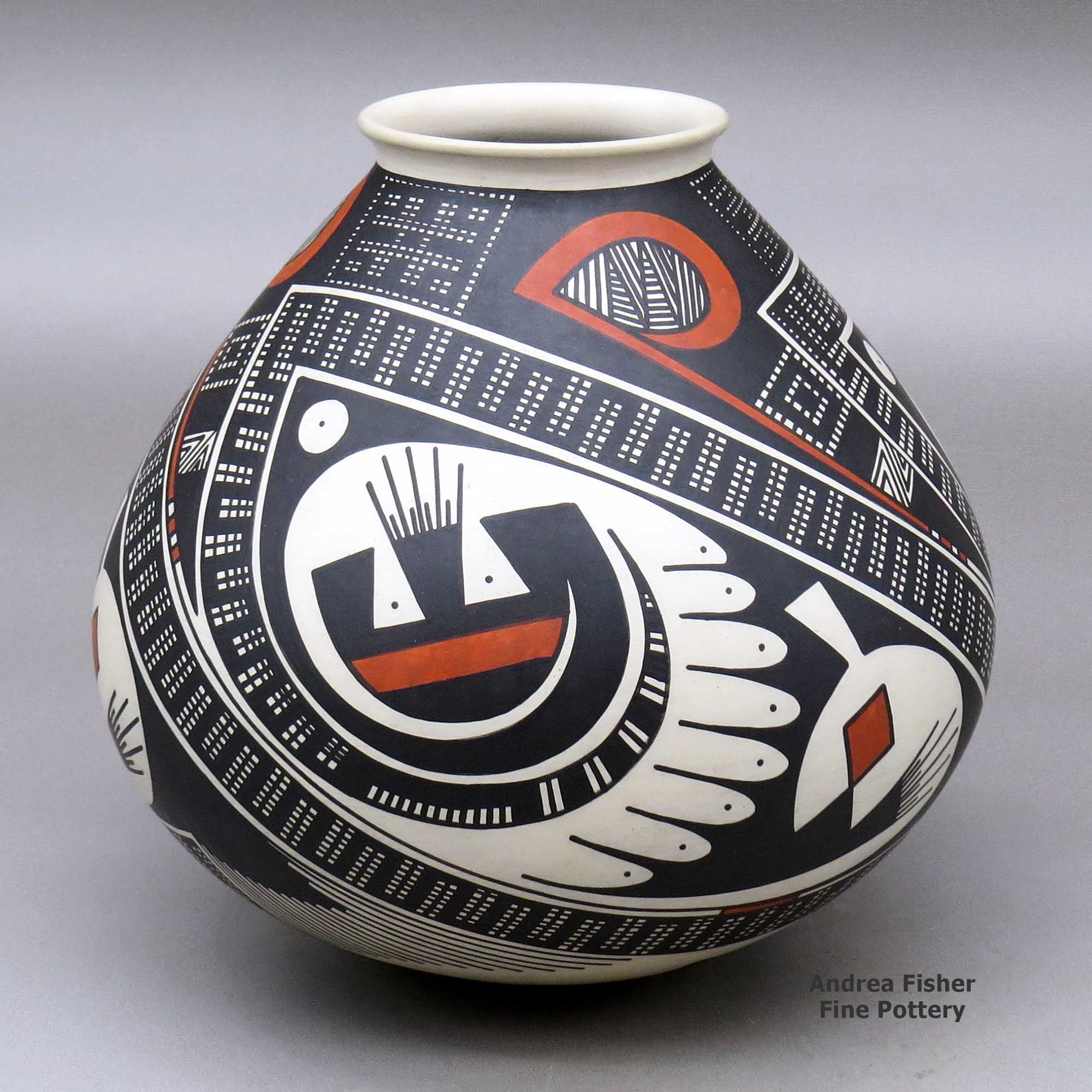 Click or tap to see a larger view A jar with a flared rim and decorated with a three panel geometric design made by Juan Quezada Sr of Mata Ortiz and Casas Grandes