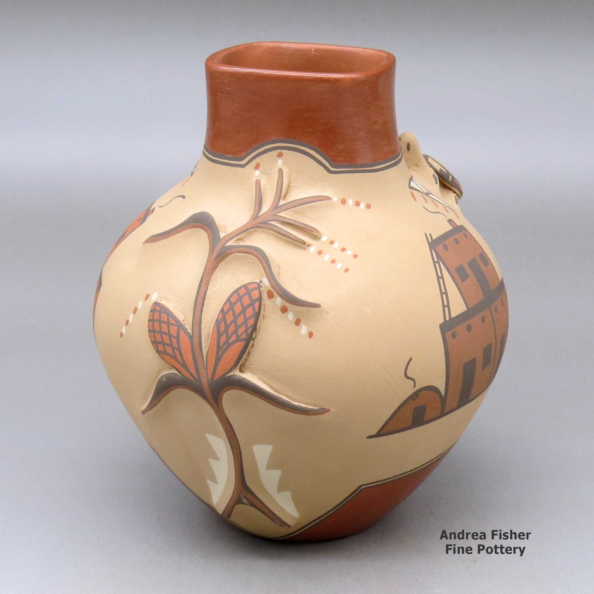 Click or tap to see a larger view A polychrome jar with a squarish short neck, turtle and cornstalk appliques and decorated with a pueblo, cornstalk, flower and geometric design made by Bertha Gachupin of Jemez