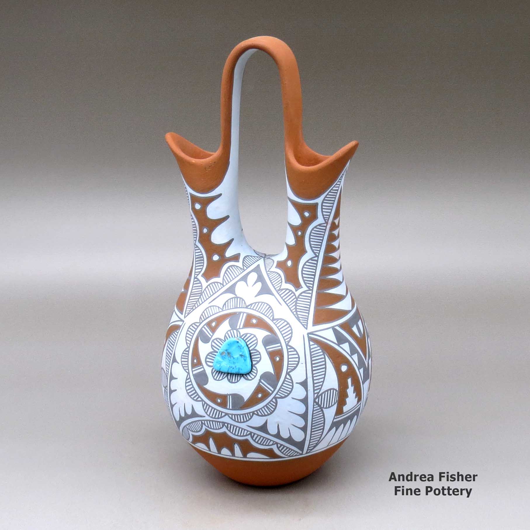 Click or tap to see a larger view A polychrome wedding vase with two pieces of inlaid turquoise and decorated with a geometric design made by Mary Small of Jemez