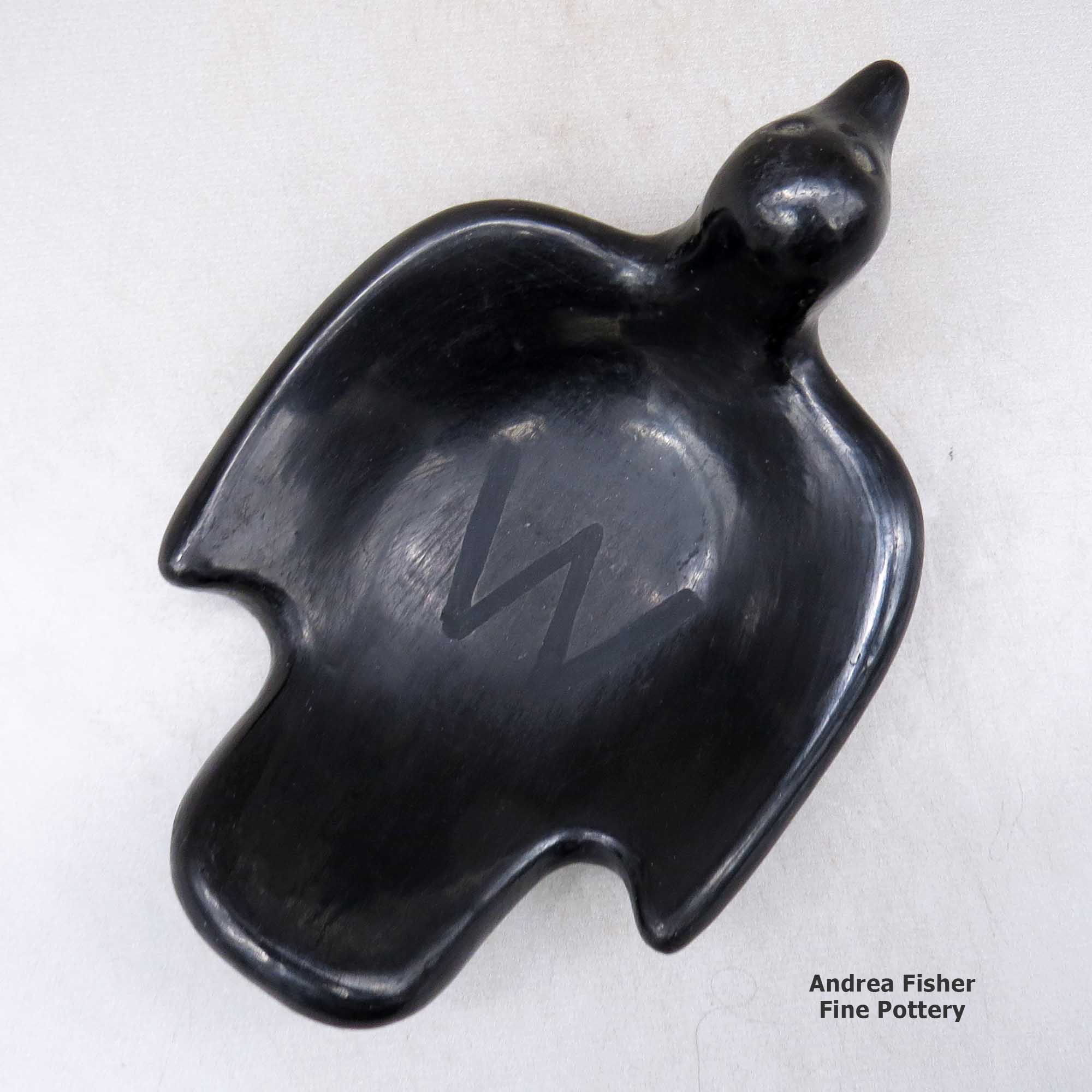 Click or tap to see a larger view A black bird bowl with a geometric design on the inside made by Rose Gonzales of San Ildefonso