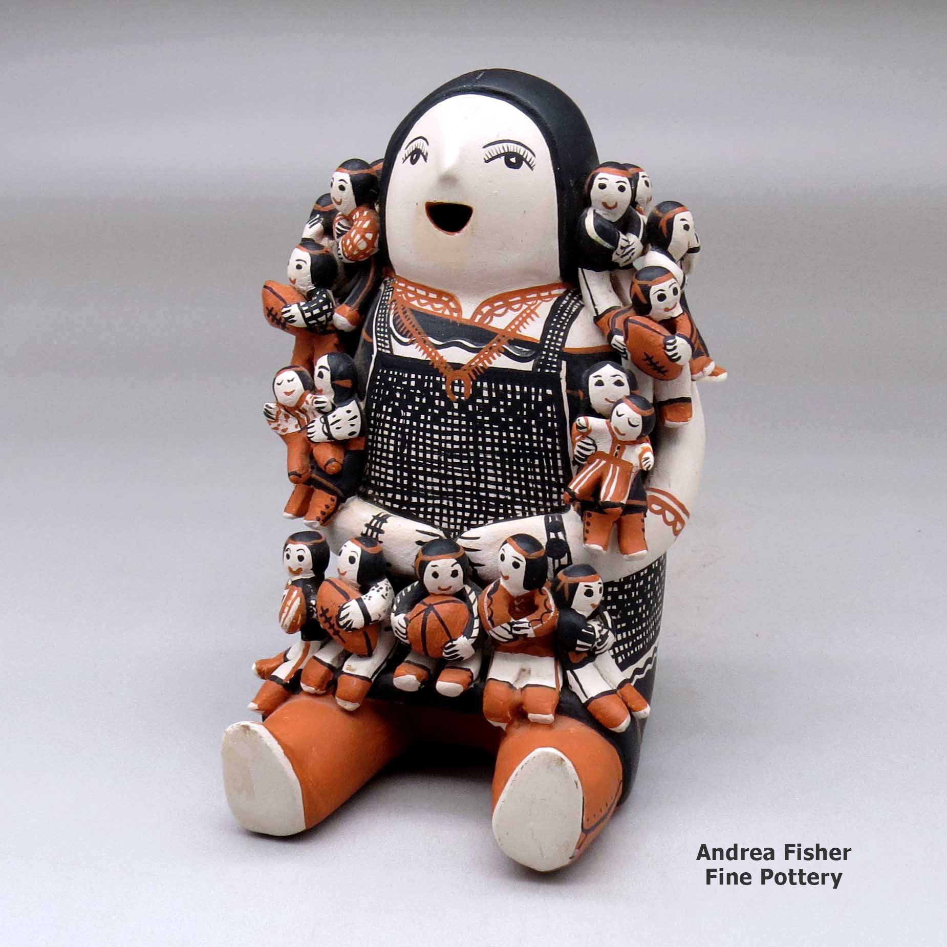 Click or tap to see a larger view A grandmother storyteller with seventeen children made by Louise Suina of Cochiti