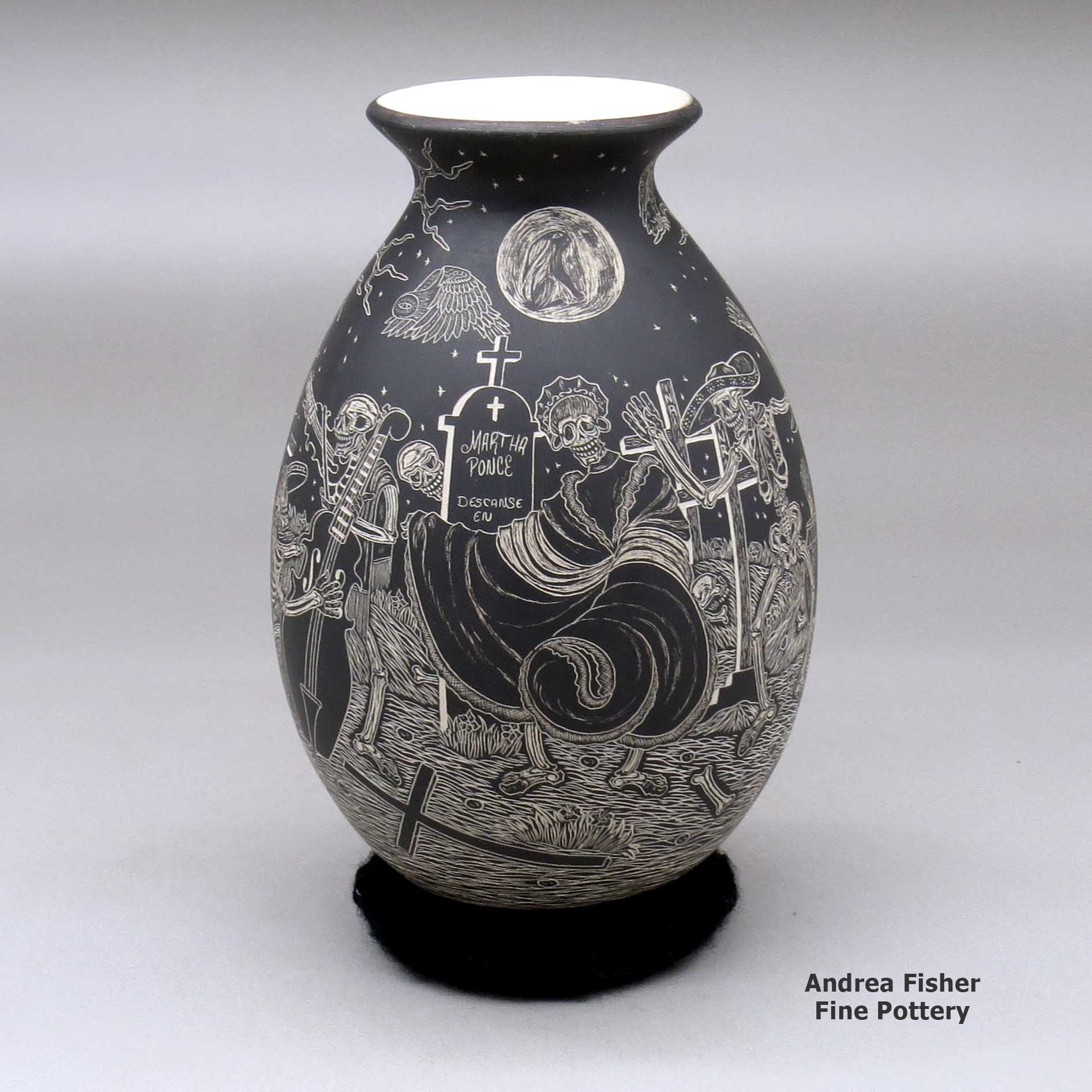 Click or tap to see a larger view A black on white jar decorated with a sgraffito Night of the Dead at the Cemetery design made by Hector Javier Martinez of Mata Ortiz and Casas Grandes