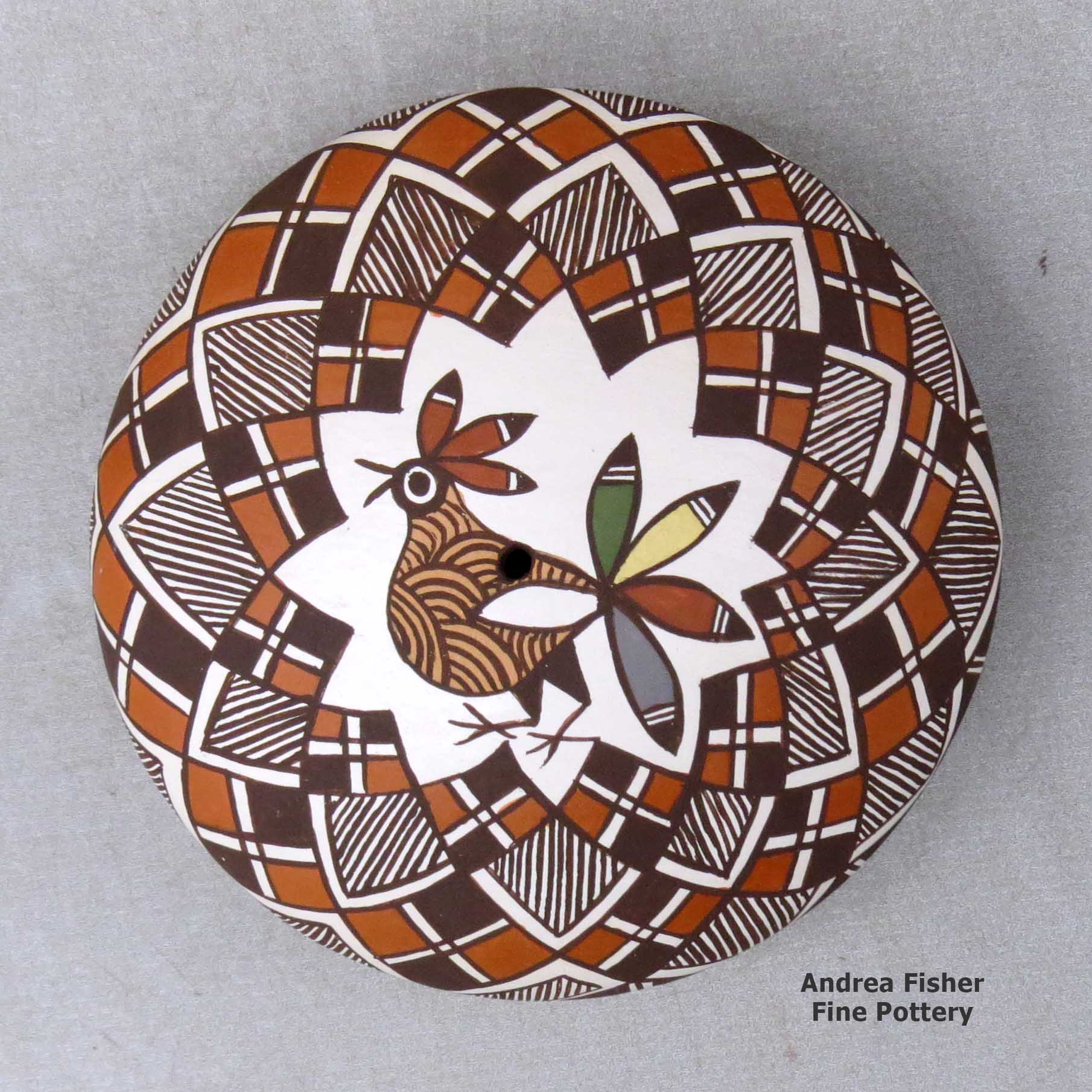Click or tap to see a larger view A polychrome seed pot decorated above the shoulder with a bird, fineline and geometric design made by Diane Lewis of Acoma