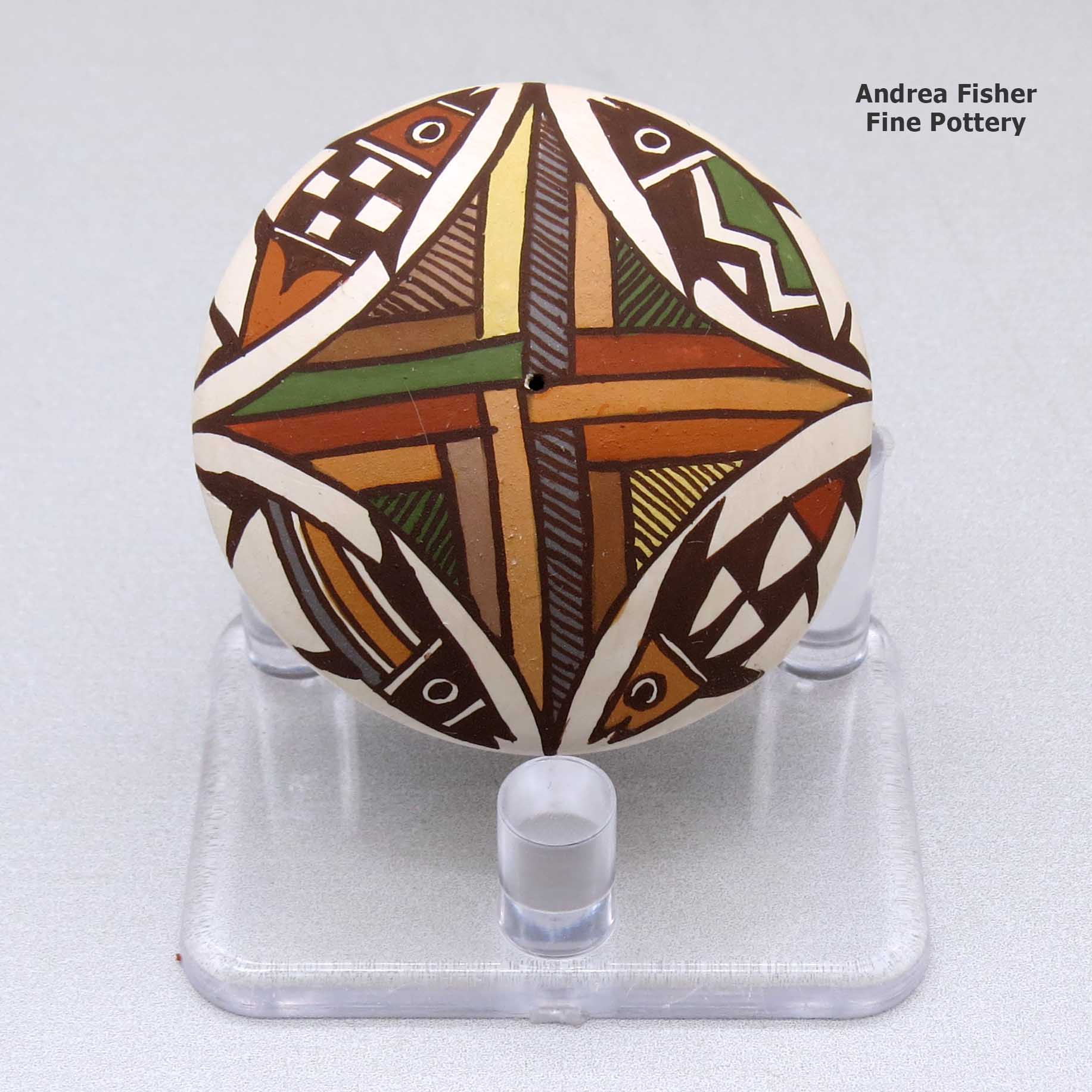 Click or tap to see a larger view A miniature polychrome seed pot decorated with a four-panel fish and geometric design above the shoulder made by Diane Lewis of Acoma