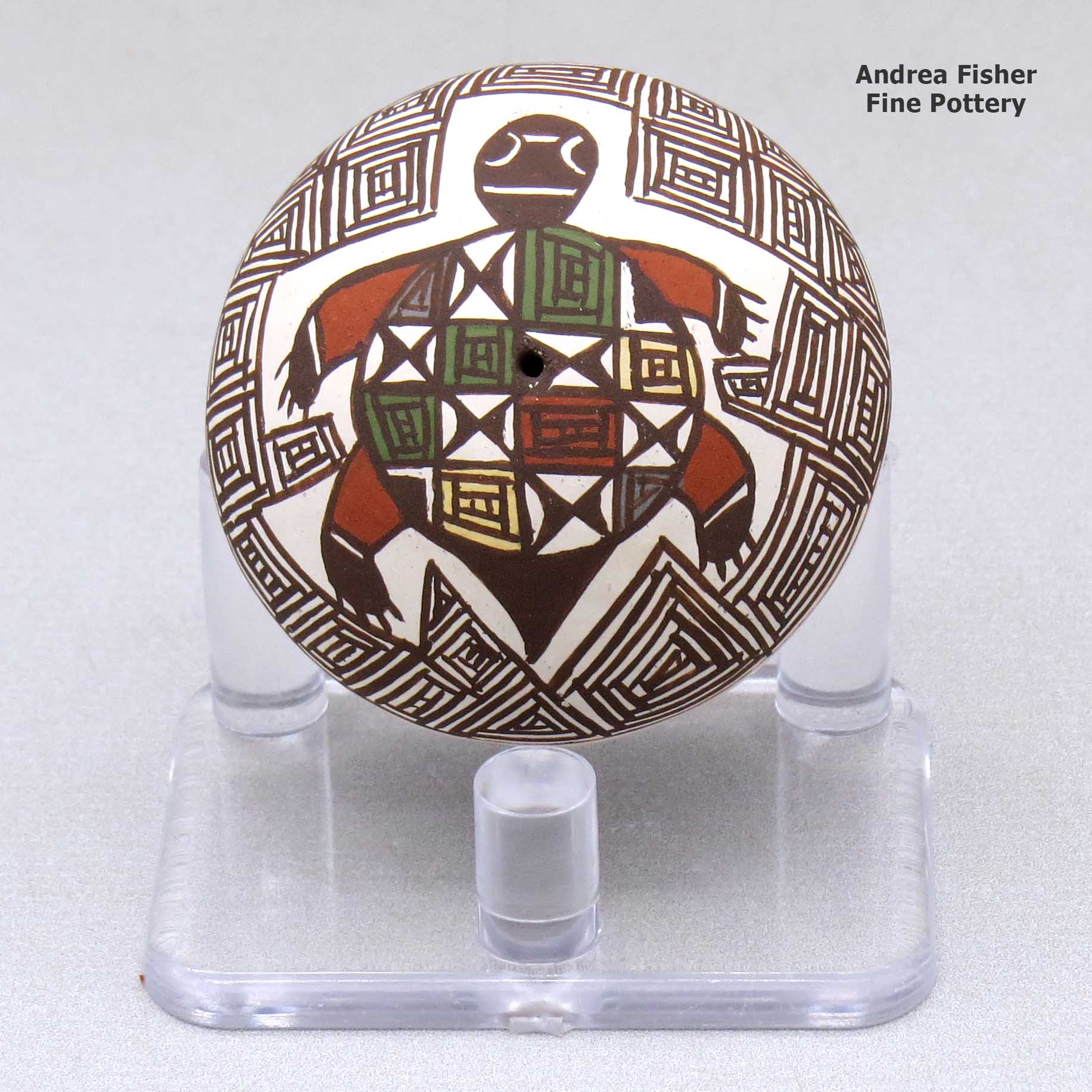 Click or tap to see a larger view A miniature polychrome seed pot decorated with a turtle, fineline and geometric design above the shoulder made by Diane Lewis of Acoma
