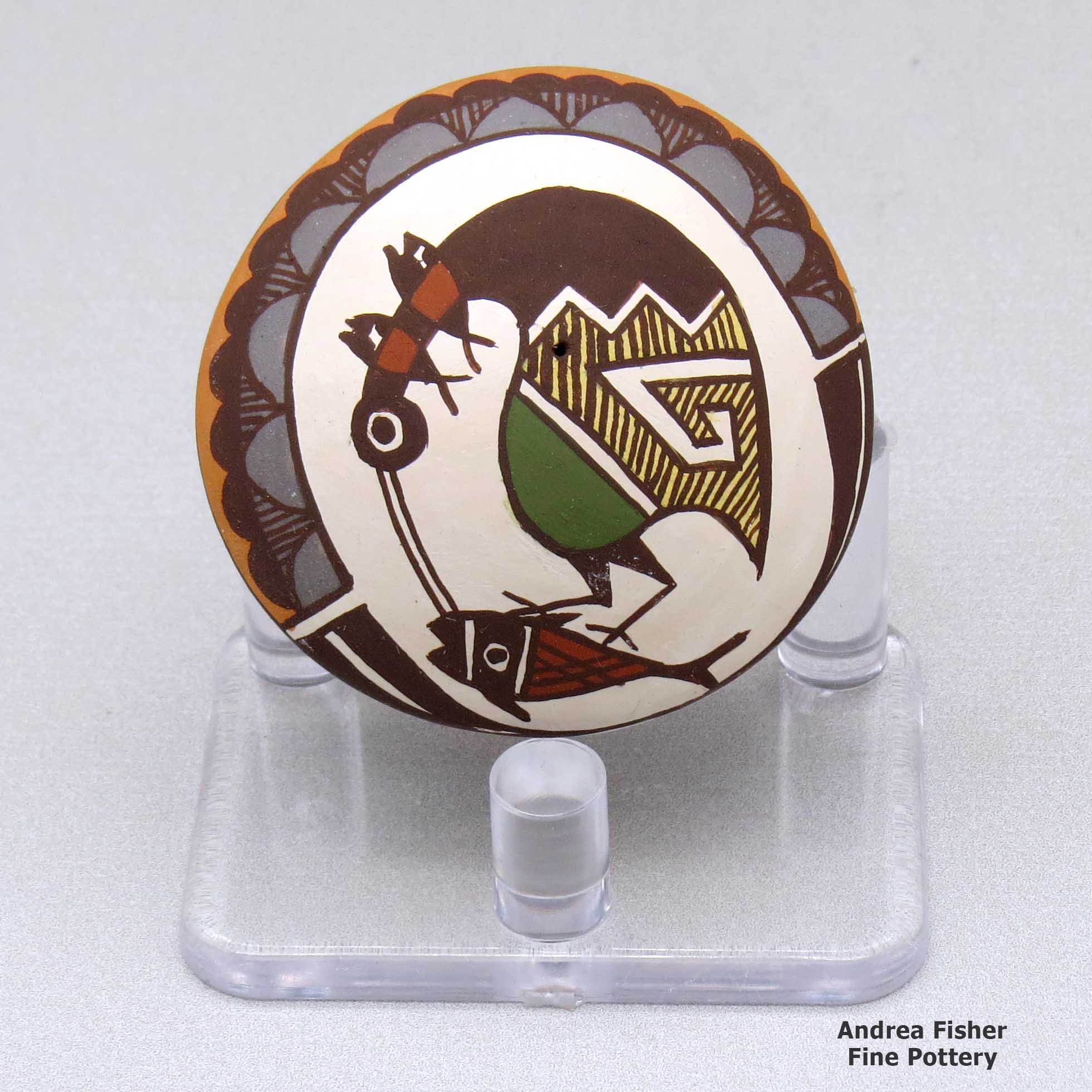 Click or tap to see a larger view A miniature polychrome seed pot decorated with a cloudeater, fish and geometric design above the shoulder made by Diane Lewis of Acoma
