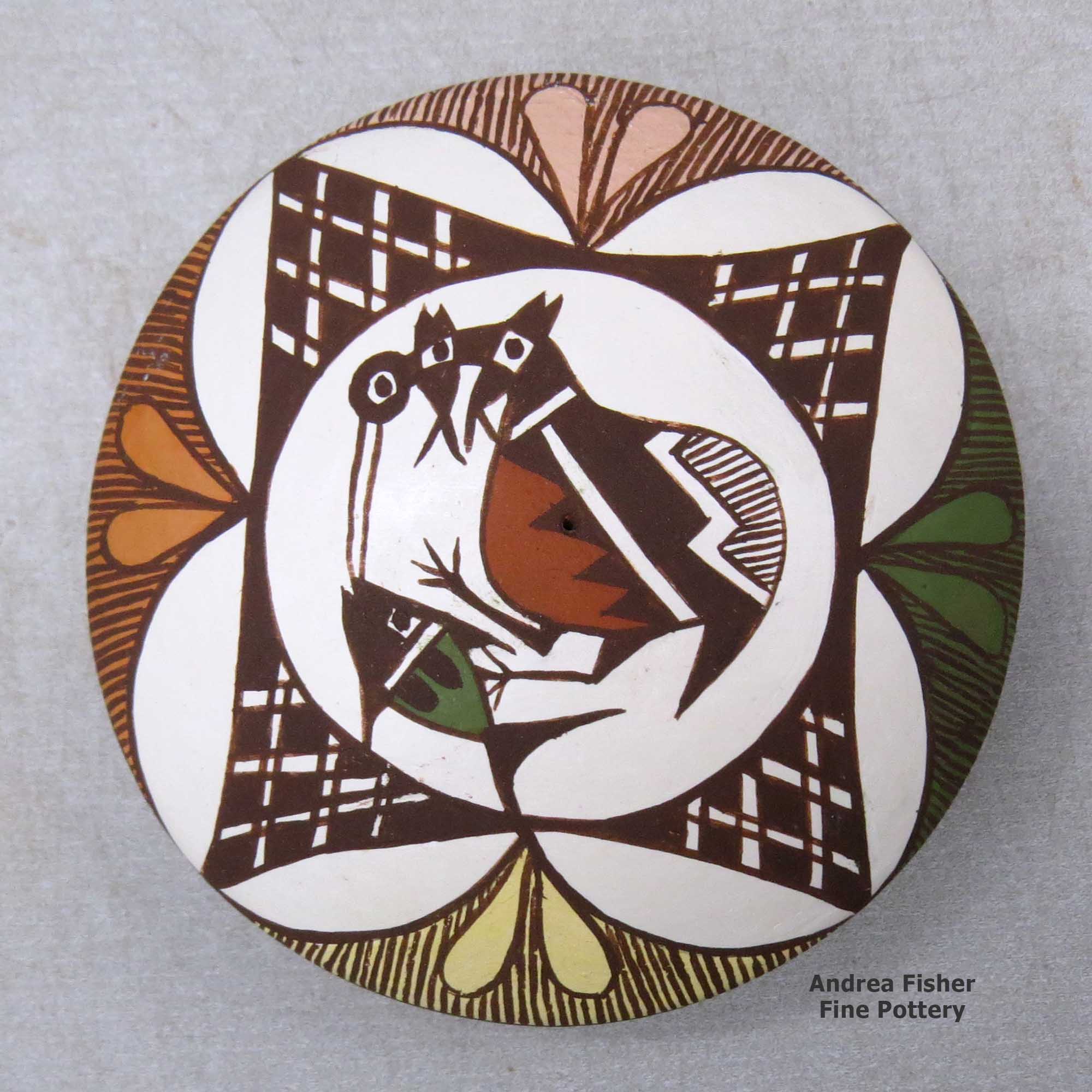 Click or tap to see a larger view A polychrome seed pot decorated above the shoulder with a cloudeater, fish, fineline and geometric design made by Diane Lewis of Acoma