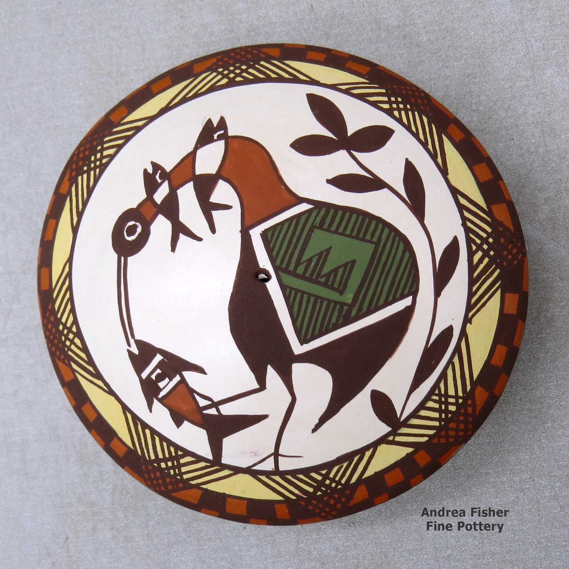 Click or tap to see a larger view A polychrome seed pot decorated above the shoulder with a cloudeater, fish, fineline and geometric design made by Diane Lewis of Acoma