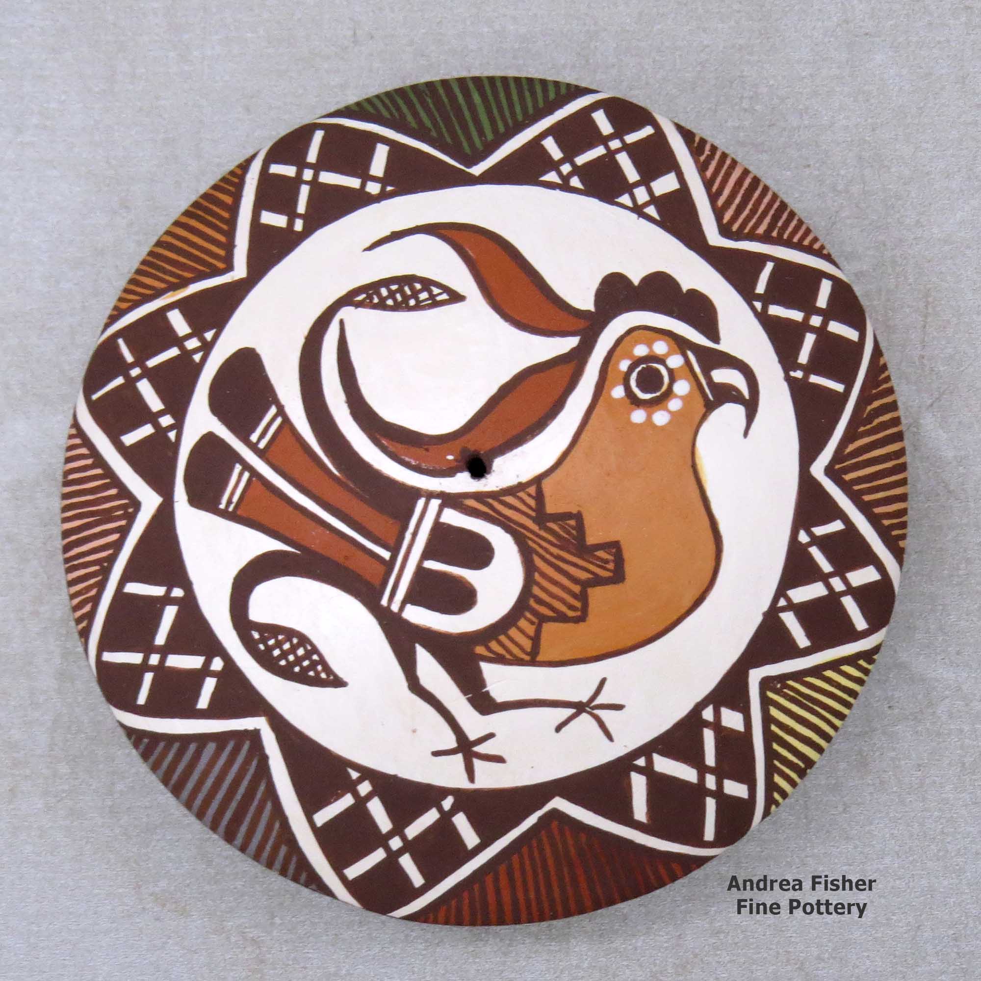 Click or tap to see a larger view A polychrome seed pot decorated above the shoulder with a parrot, fineline and geometric design made by Diane Lewis of Acoma