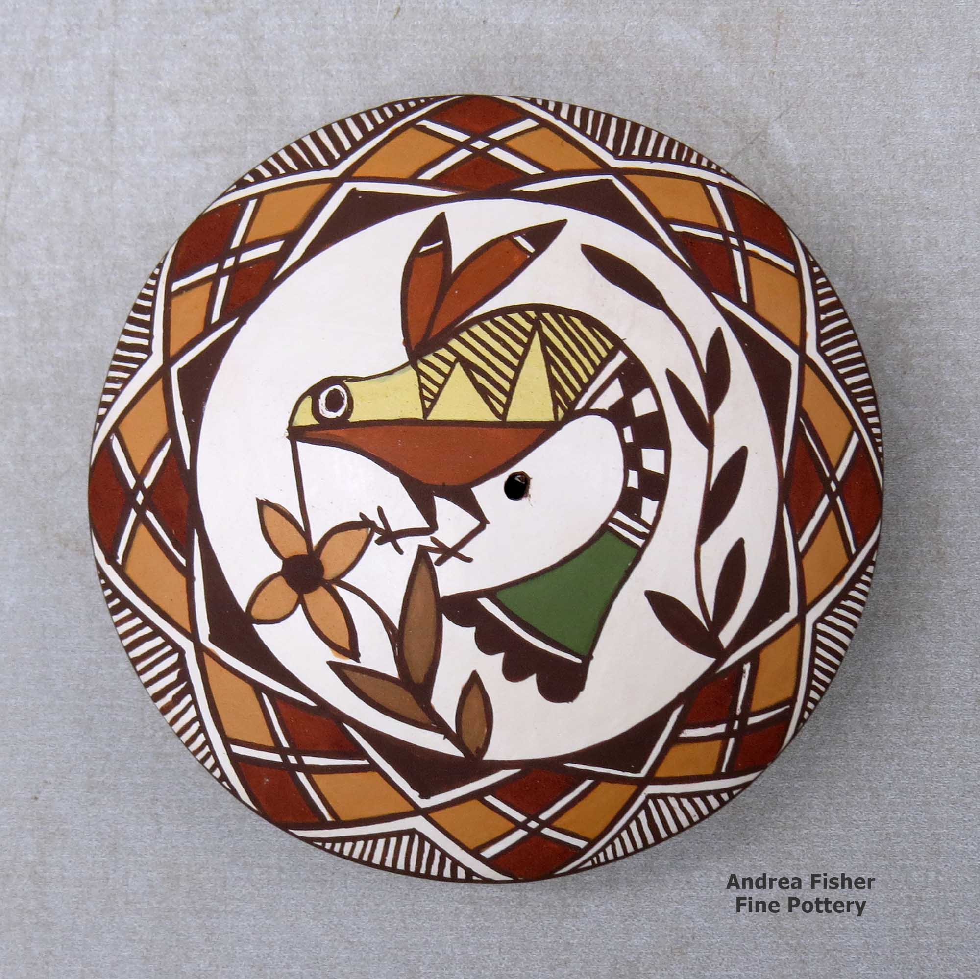 Click or tap to see a larger view A polychrome seed pot decorated above the shoulder with a hummingbird, flower and geometric design made by Diane Lewis of Acoma