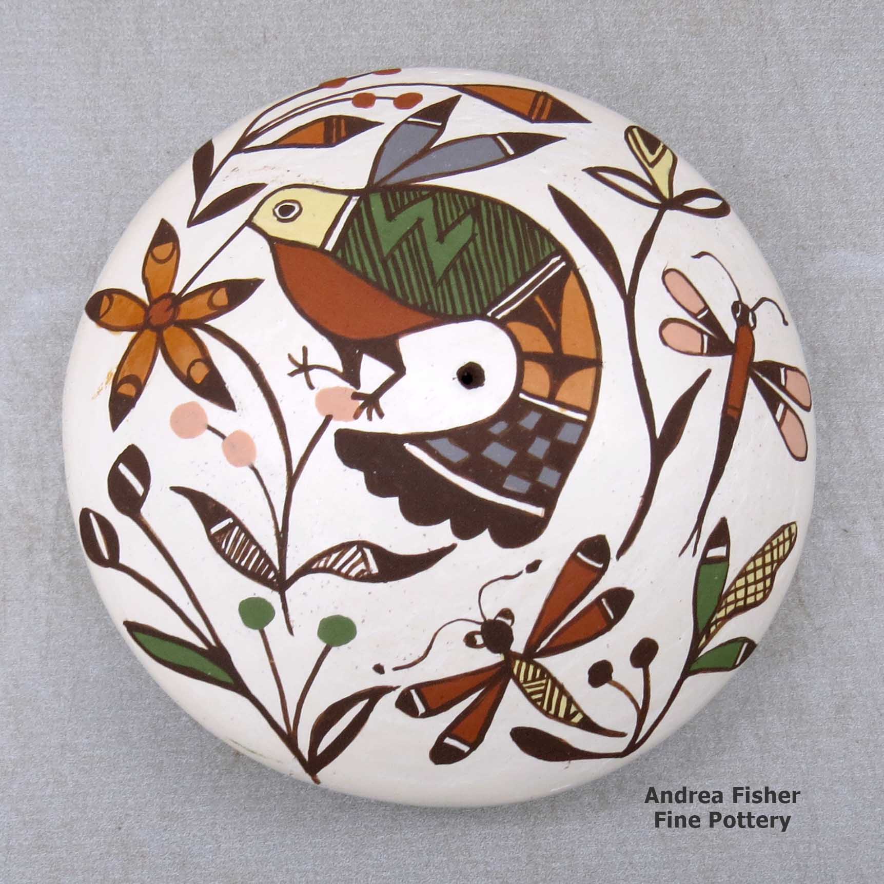 Click or tap to see a larger view A polychrome seed pot decorated above the shoulder with a hummingbird, dragonfly, flower and geometric design made by Diane Lewis of Acoma