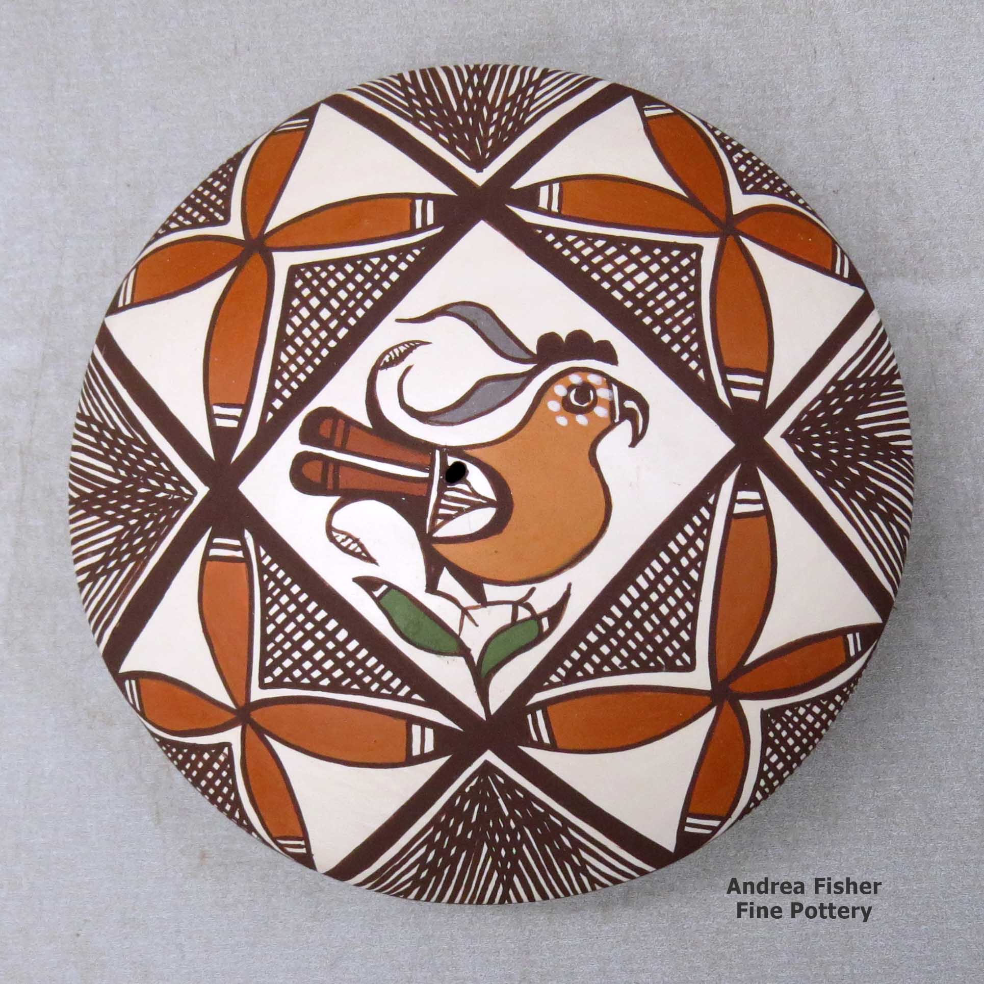 Click or tap to see a larger view A polychrome seed pot decorated above the shoulder with a parrot, plant, fineline and geometric design made by Diane Lewis of Acoma