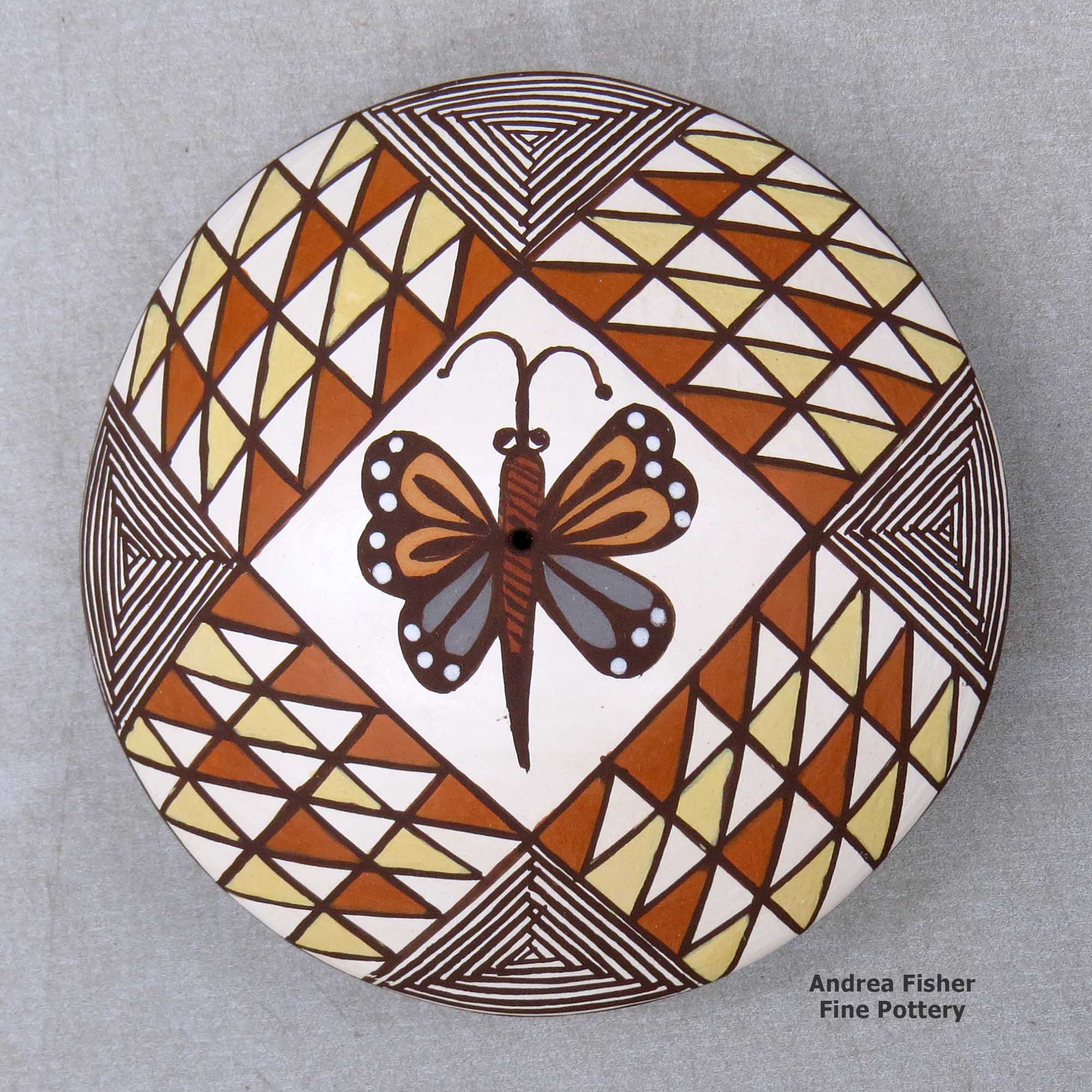 Click or tap to see a larger view A polychrome seed pot decorated above the shoulder with a butterfly and geometric design made by Diane Lewis of Acoma